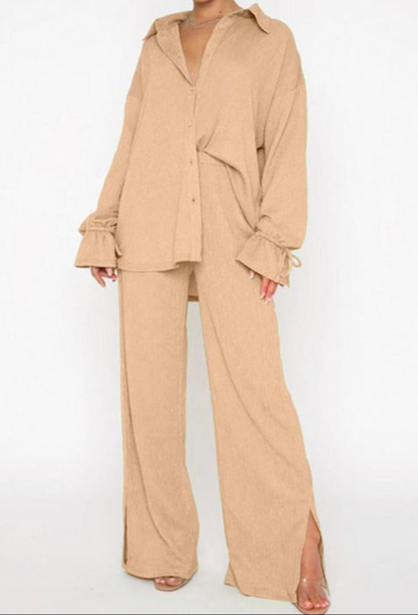 Woman wearing a beige outfit on a white background