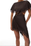 Woman wearing a brown dress with lace details on a white background